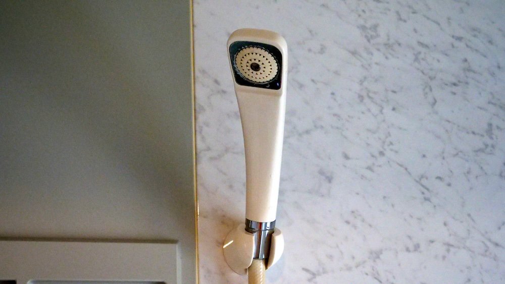 Japanese style shower head in Osaka guesthouse in Japan 