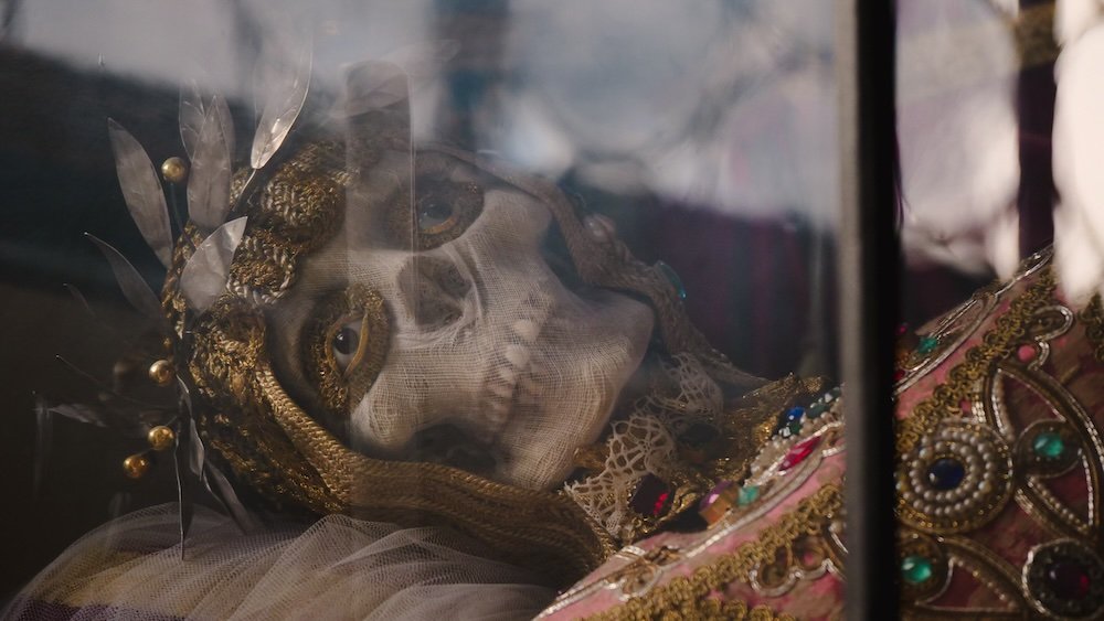 Jeweled Skeleton of St. Munditia decked out in precious stones and golden ornaments displayed in a glass case in Munich, Germany