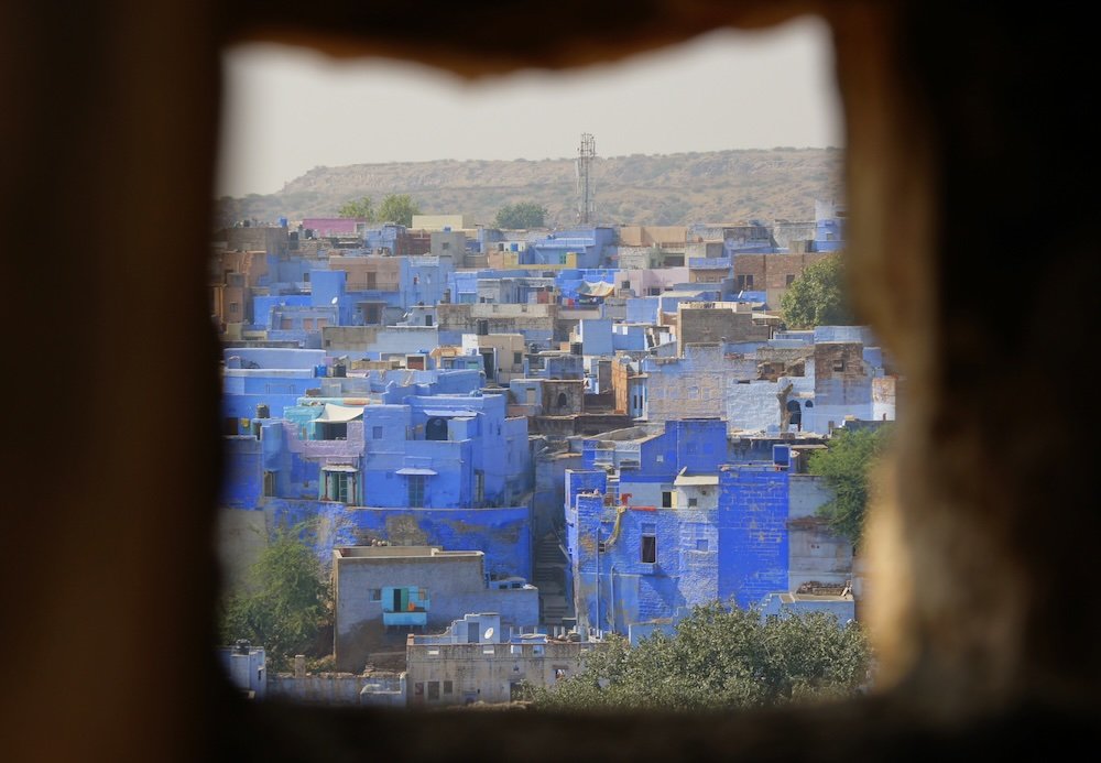 Jodhpur The Blue City as seen through a fort wall creatively framed 