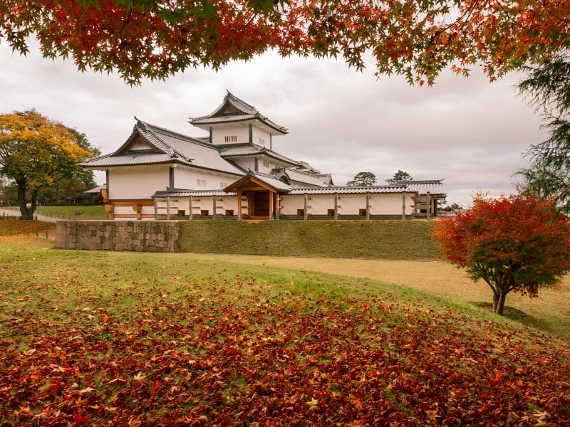 Kanazawa Castle in Japan during the autumn season where visitors are treated to stunning colors