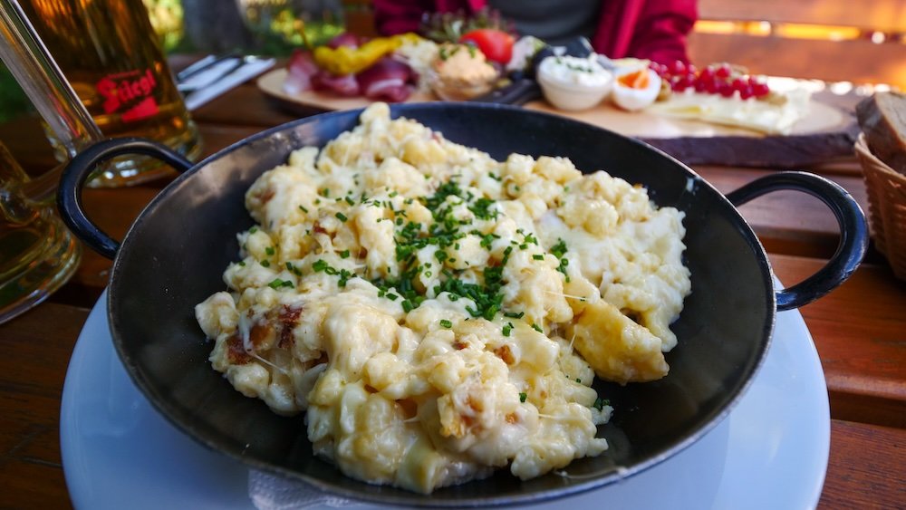 Kasnocken Kasspatzen Soft dumplings or small pasta bits smothered in melted cheese and topped with crispy onions in Gaisberg, Austria