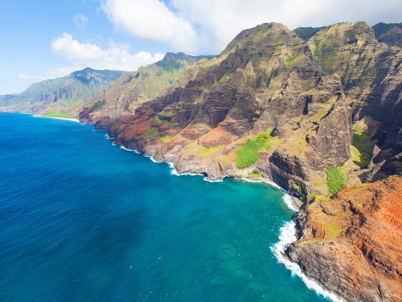 Rugged coastal scenery visiting Kauai, Hawaii on a group tour 