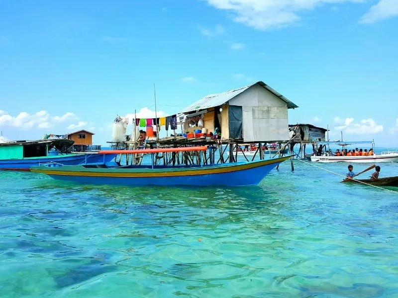 Ketagan Island with a view of a boat in Semporna, Malaysia 