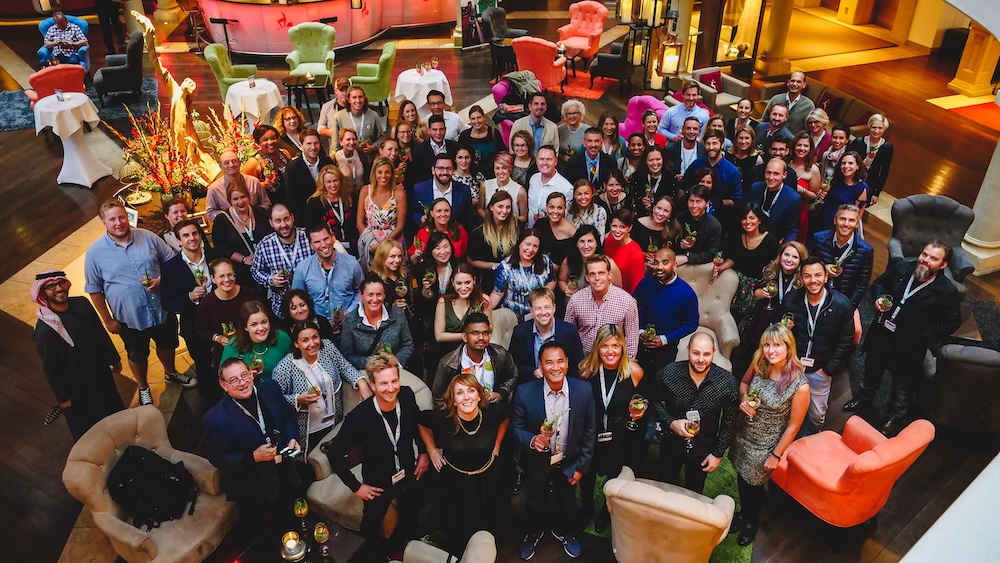 Kitzbühel, Austria — Nomadic Samuel and Audrey Bergner attend the Social Travel Summit, joining hundreds of travel creators at a professional networking event inside a stylish alpine hotel lounge.