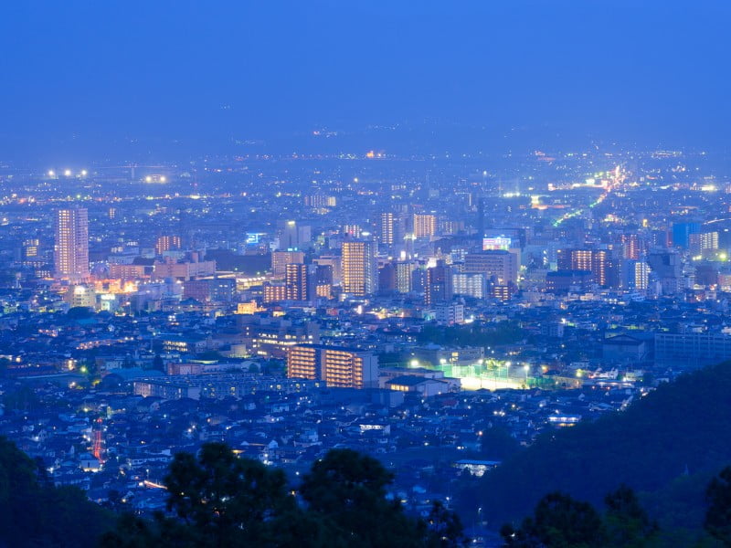 Kofu city at night from a mountain viewpoint in Japan 