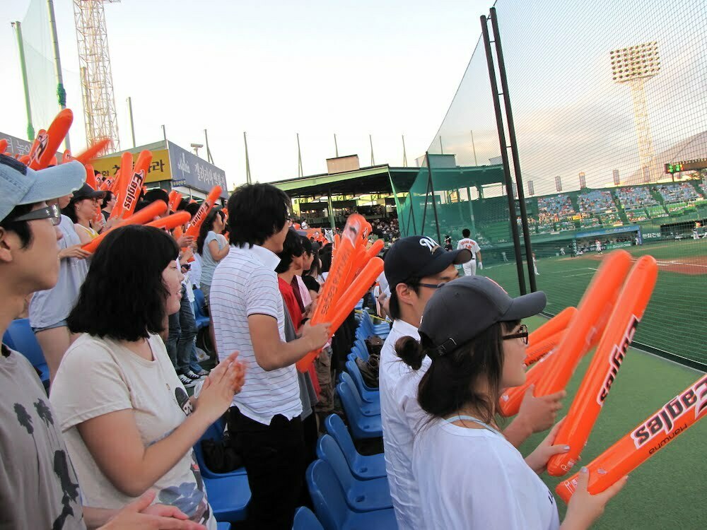 Korean baseball game fans cheering in Daejeon, South Korea 