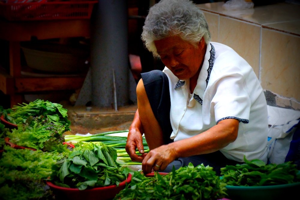 Korean lady selling vegetables in Pyeongtaek, Korea 