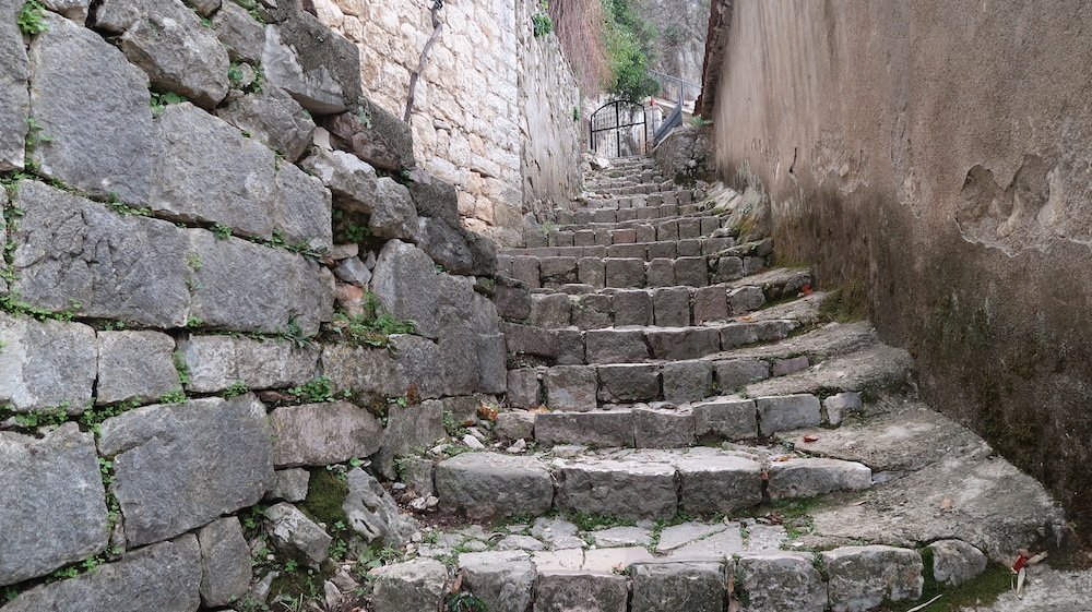 Kotor old stone path leading to a gate in Montenegro 