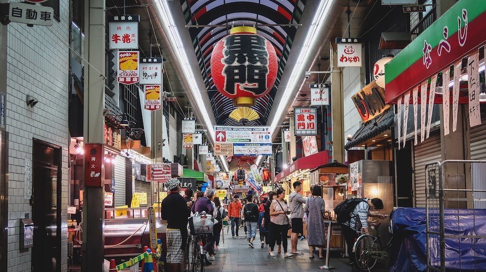 Kuromon Ichiba Market 黒門市場 the vibrant atmosphere of Osaka’s premier food market renowned for its fresh produce, seafood, and street food