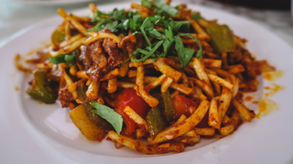 Kyrgyz fried noodles with meat as a spicy dish worth trying in Kyrgyzstan 