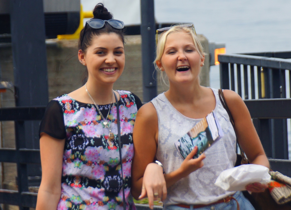 Ladies sharing a laugh and smiles after getting off of the ferry from Helsinki to Suomenlinna