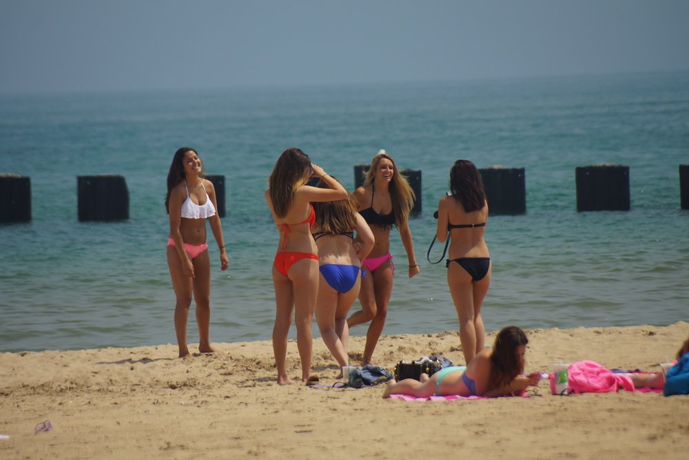 Ladies wearing bikinis at North Avenue Beach in Chicago