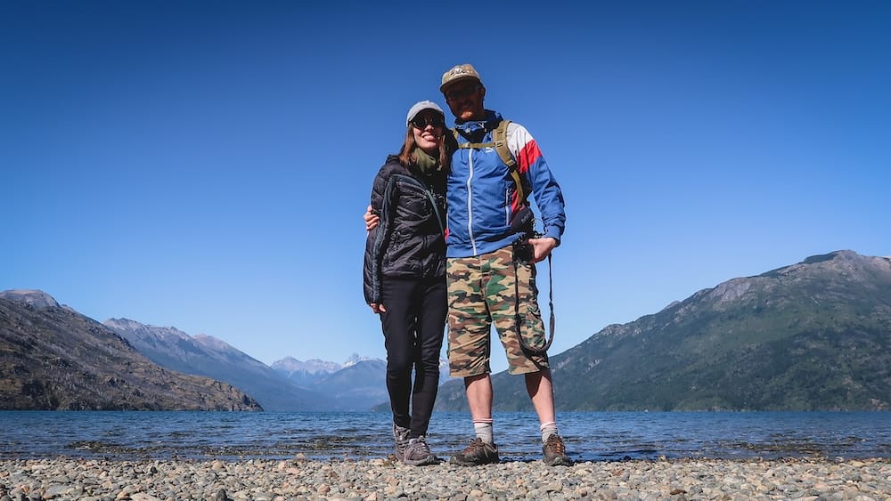Lago Puelo Patagonia UV exposure cold mountain weather deceptive sun Samuel Jeffery Audrey Bergner Lago Puelo Patagonia Argentina shoreline photo of Samuel Jeffery and Audrey Bergner standing under clear blue skies in cool mountain air while exposed to intense UV radiation at high latitude despite cold temperatures