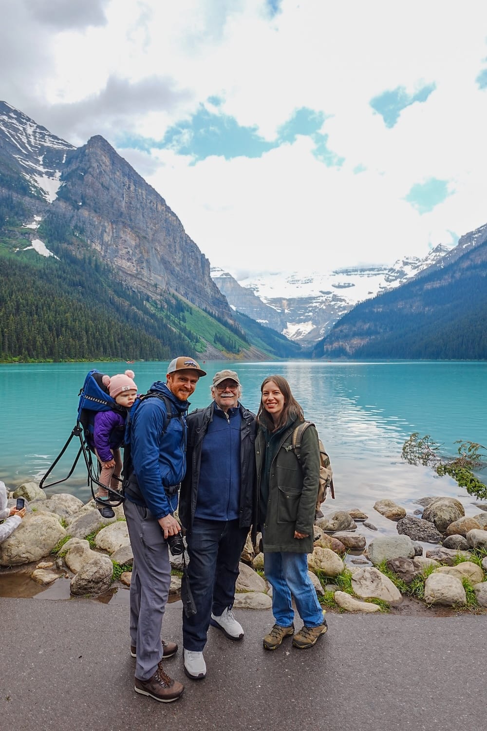 Lake Louise Banff National Park Alberta Canada With Samuel Audrey Aurelia and Daniel on a Family Trip Samuel Jeffery, Audrey Bergner, Daniel Bergner and Aurelia Jeffery standing beside Lake Louise in Banff National Park, Alberta, Canada, with turquoise water and steep mountain scenery behind them.