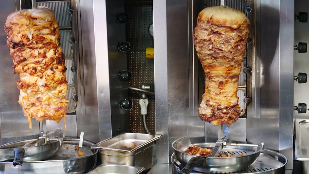 Lamb and chicken on the rotating spit - gyro in Athens, Greece 