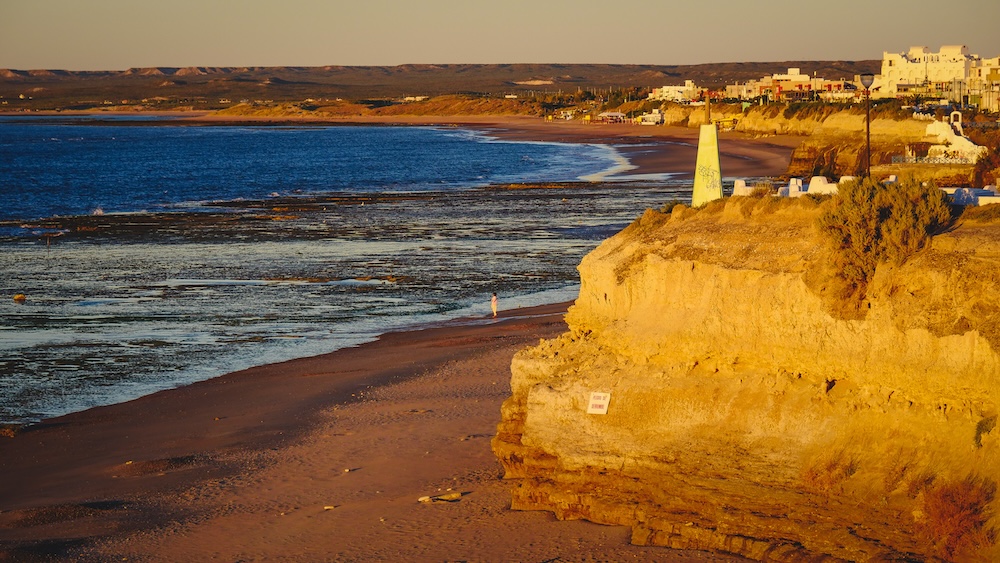 Las Grutas rugged sandstone cliffs and Atlantic coastline views in Río Negro Patagonia Las Grutas rugged coastline and sandstone cliffs in Río Negro, Argentina, overlooking wide Atlantic Ocean beaches at low tide along Patagonia’s northern coastal route where dramatic rock formations and quiet shoreline views define this seaside town.