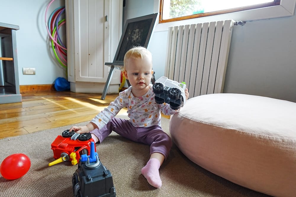Aurelia Jeffery playing in the children’s room at Llao Llao Hotel, Bariloche, Patagonia, Argentina Aurelia Jeffery sits on a carpet playing with colourful toy vehicles inside a children’s room at Llao Llao Hotel in Bariloche, Río Negro, Patagonia, Argentina.