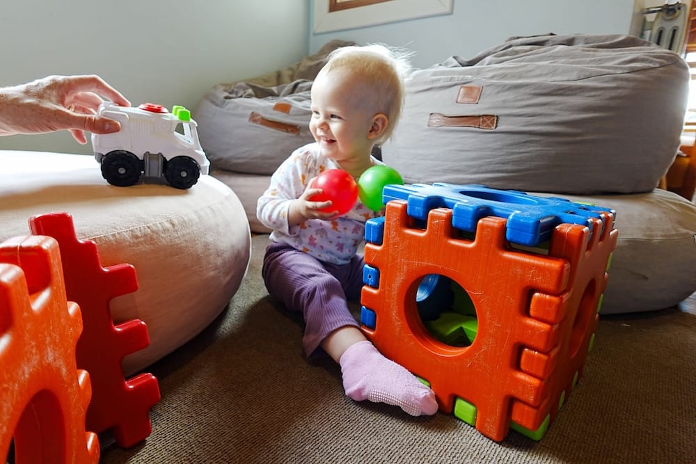 Toddler Aurelia Jeffery plays with colourful balls, a toy truck and large foam blocks inside a children’s space at Llao Llao Hotel in Bariloche, Río Negro, Argentina.