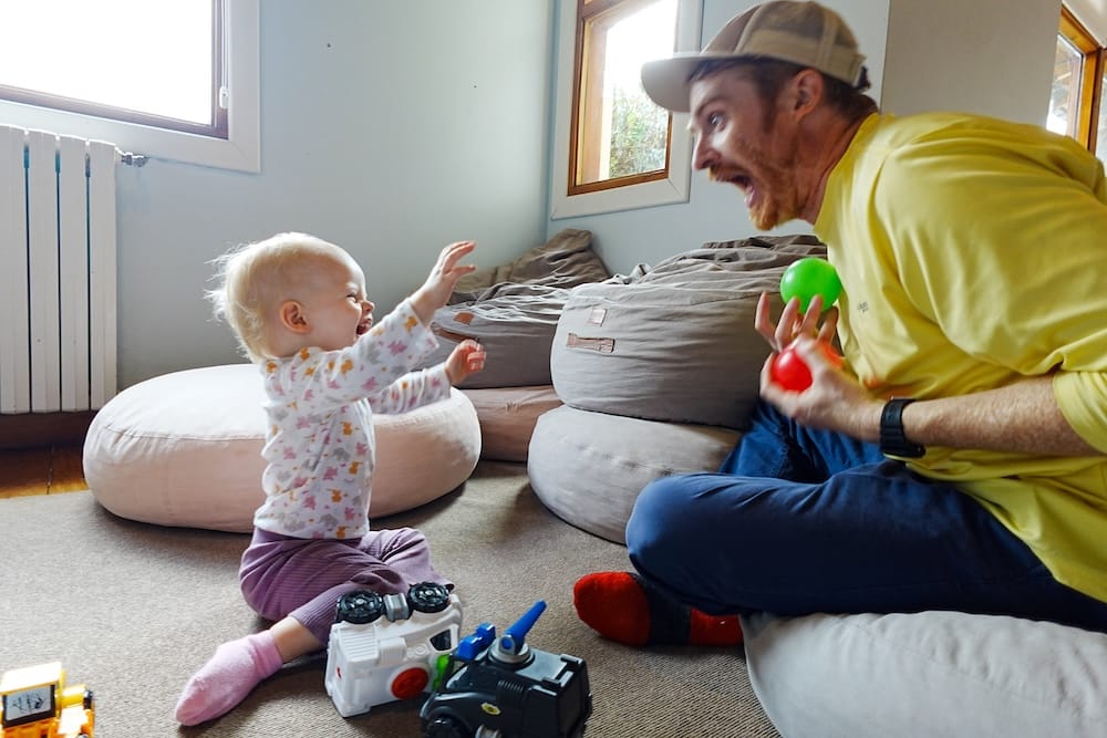 Samuel Jeffery plays with Aurelia Jeffery inside a family playroom at Llao Llao Hotel in Bariloche, Río Negro, Patagonia, Argentina, with toys, floor cushions and daylight from the windows.