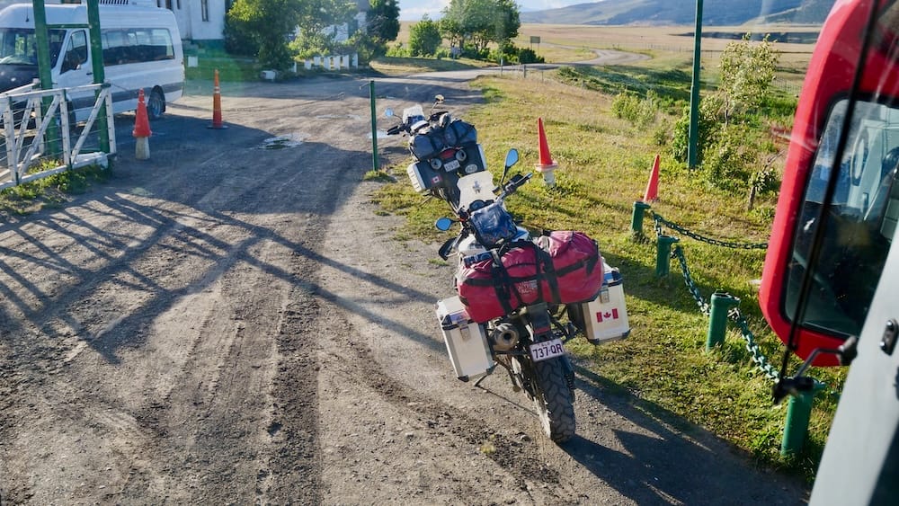 Loaded Adventure Motorcycles at an International Border Crossing Near El Calafate in Santa Cruz Patagonia Loaded adventure motorcycles waiting at an international border crossing near El Calafate, Santa Cruz, showing how Patagonia travel times stretch far beyond map distance once immigration, customs and paperwork enter the day.