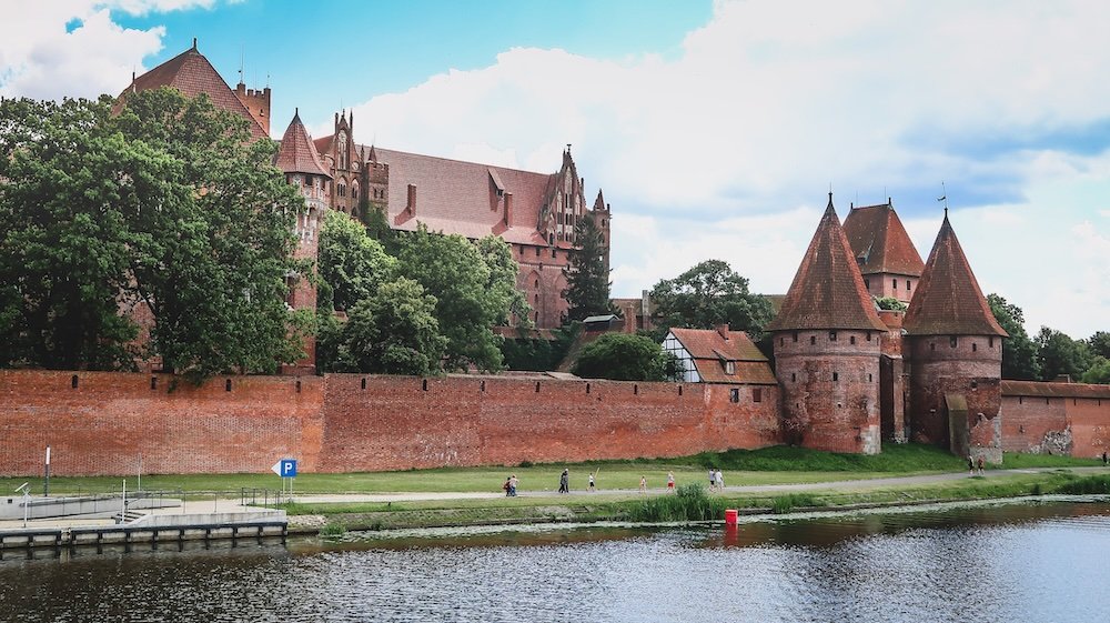 Malbork Castle riverside views from a distant vantage point in Poland 