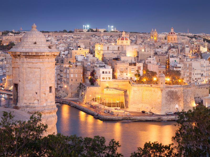 Malta At Night With Lights And Historic Buildings 