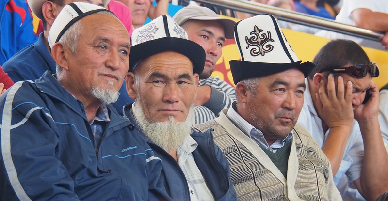 Men wearing traditional Kyrgyz hats attending the Games in Kyrgyzstan