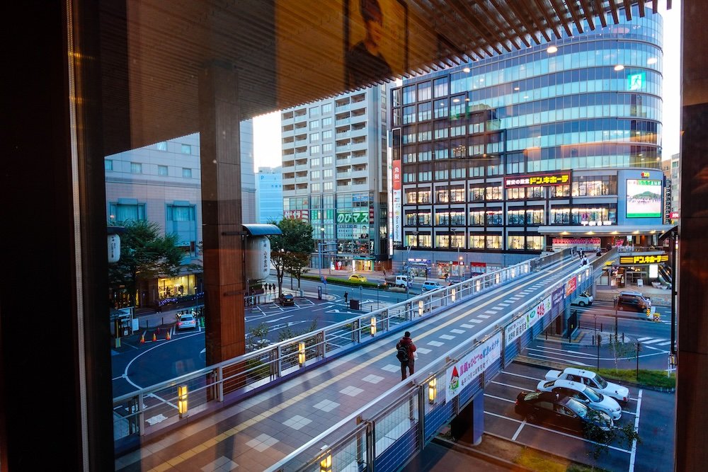 Modern pedestrian bridge connecting to Nagano train station in Japan 