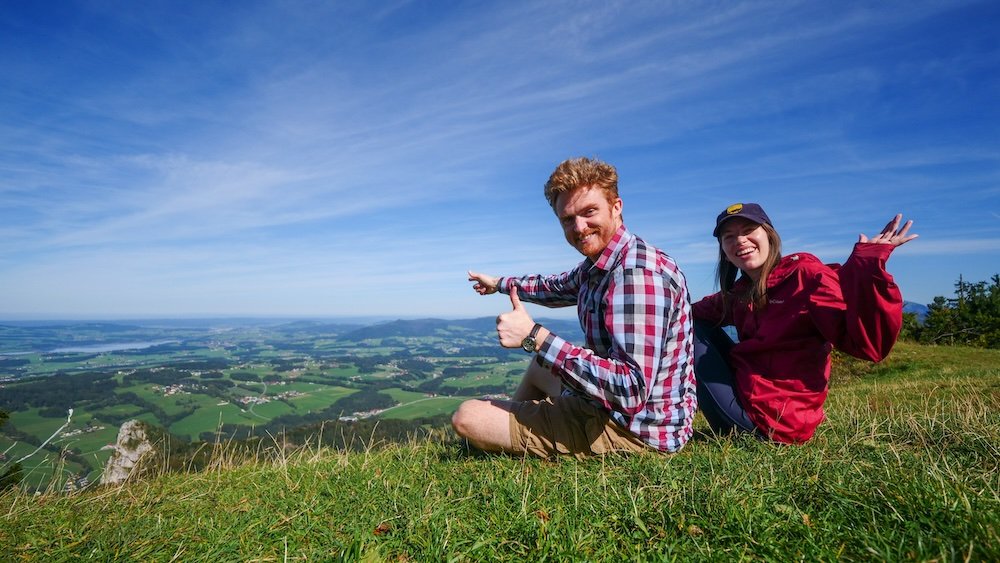 Nomadic Samuel and That Backpacker relaxing and enjoying the views after hiking to Gaisberg on a day trip from Salzburg, Austria 