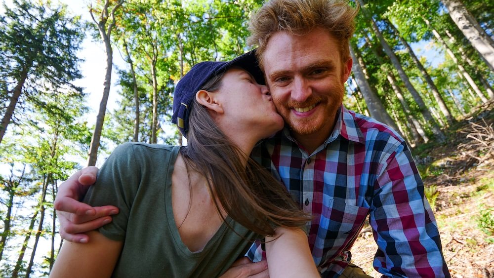 Nomadic Samuel and That Backpacker sharing a kiss in Gaisberg, Austria 