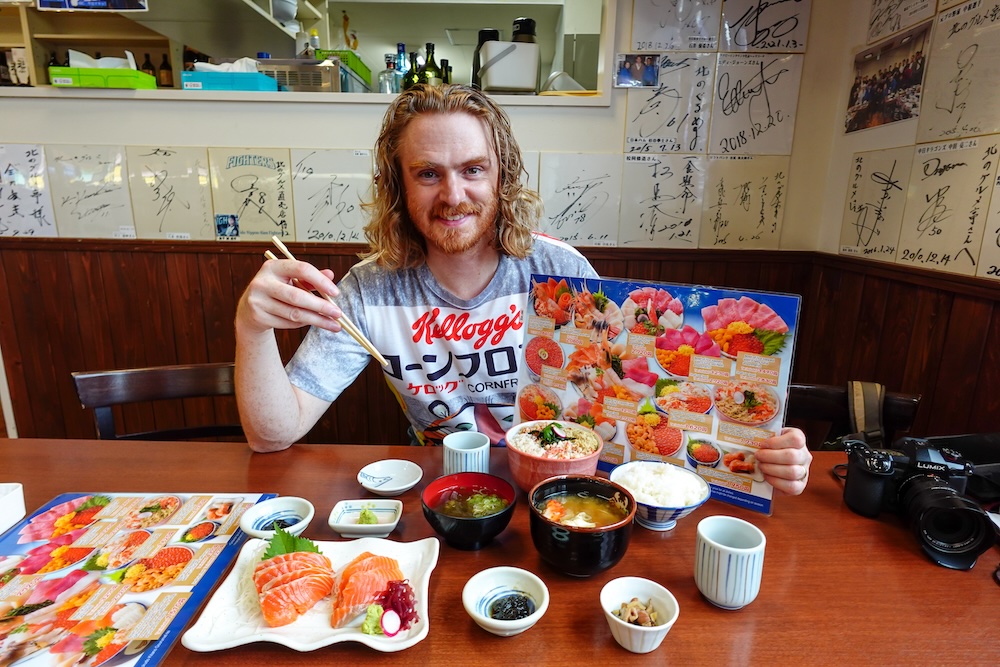 Nomadic Samuel devouring seafood feast breakfast in Sapporo, Hokkaido, Japan 
