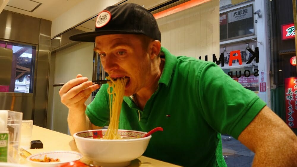 Here I Am (Nomadic Samuel) eating regional ramen noodles in Osaka, Japan 