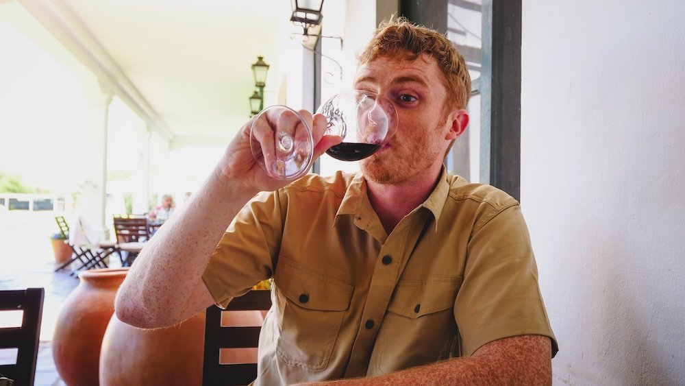 Nomadic Samuel enjoying a glass of red wine in Salta, Argentina 