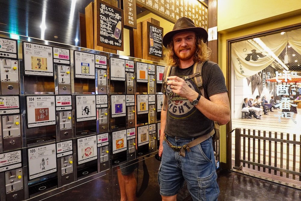 Nomadic Samuel enjoying a sake in Yuzawa, Japan 