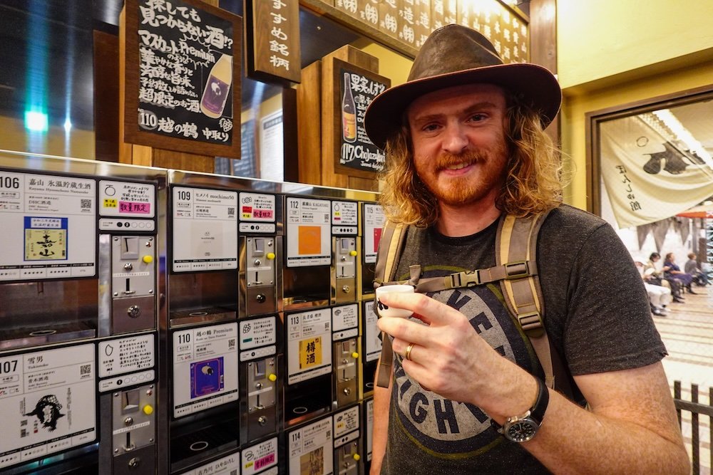 Nomadic Samuel enjoying a sake tasting at the Ponshukan Sake Museum in Yuzawa, Japan