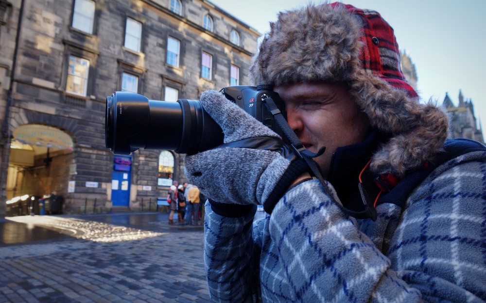 Nomadic Samuel enjoying a walking tour in Edinburgh, Scotland 