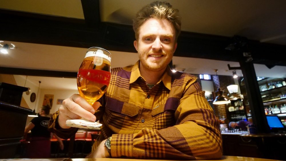 Nomadic Samuel enjoying beer at Krone in Luneburg, Germany 