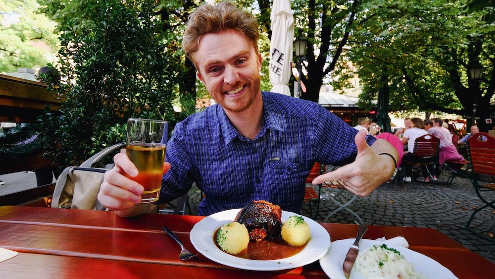 Nomadic Samuel enjoying classic Bavarian cuisine German food in Munich, Germany 