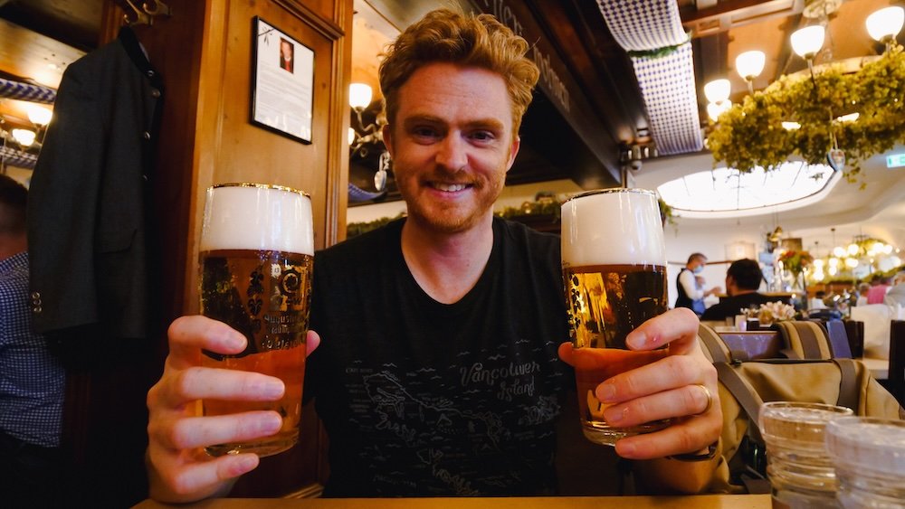 Nomadic Samuel enjoying double beers in Munich, Bavaria, Germany 