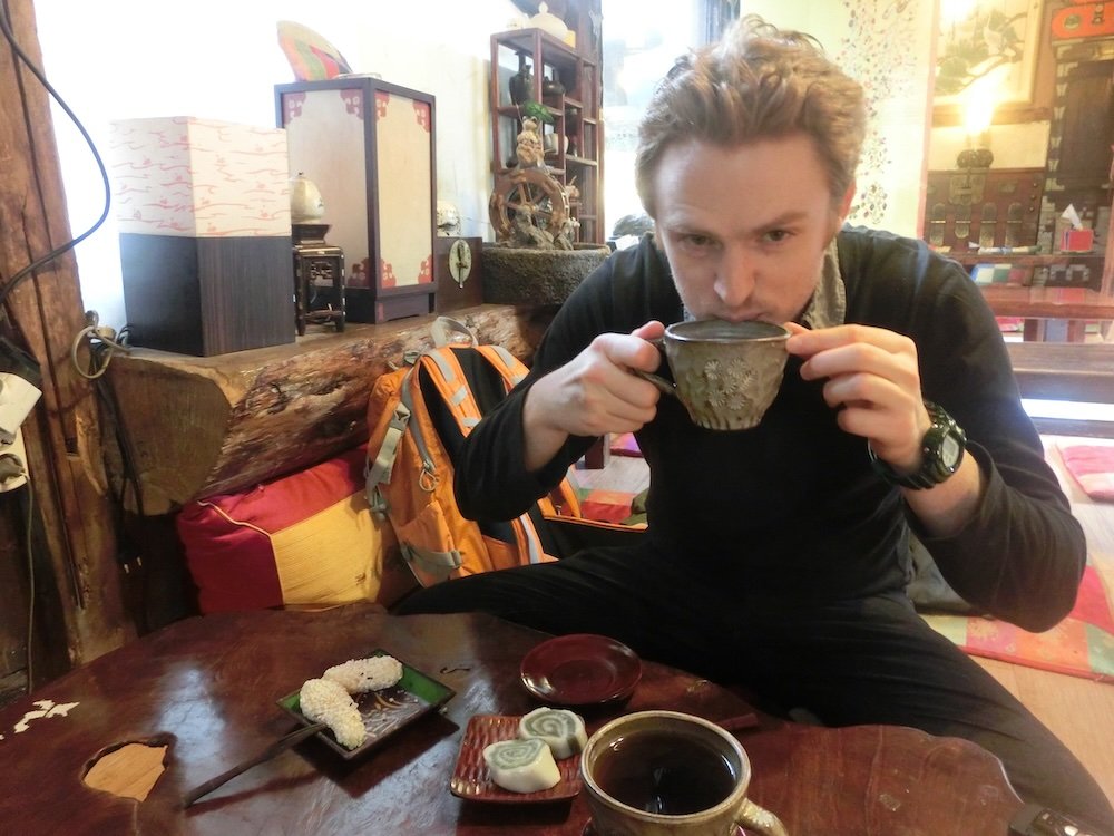 Nomadic Samuel enjoying traditional Korean tea at a tea house in Insadong, Seoul, Korea 