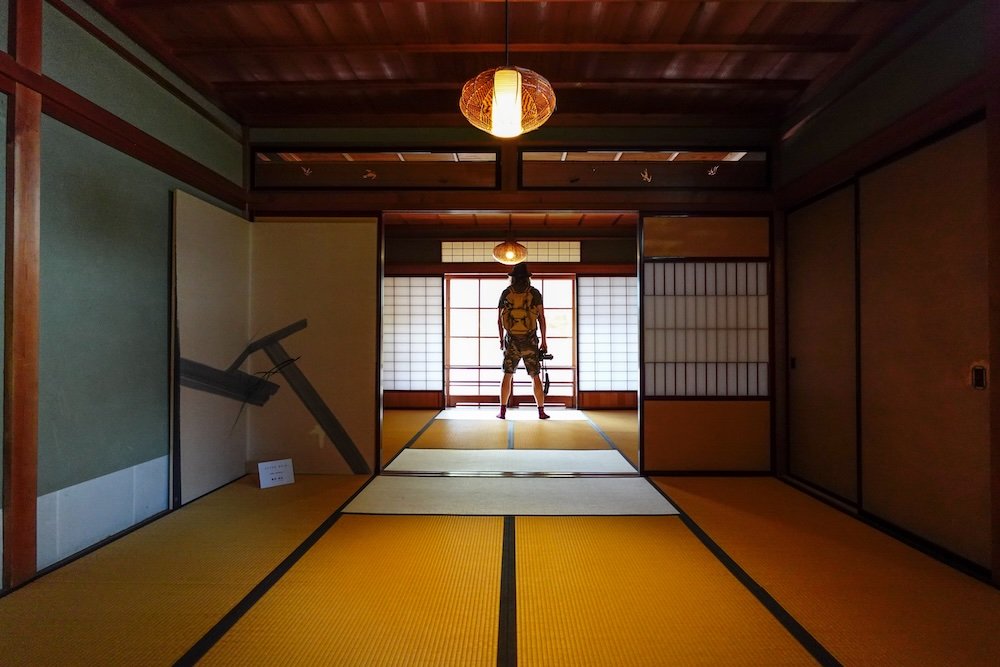 Nomadic Samuel exploring traditional Japanese buildings in Takayama, Japan 