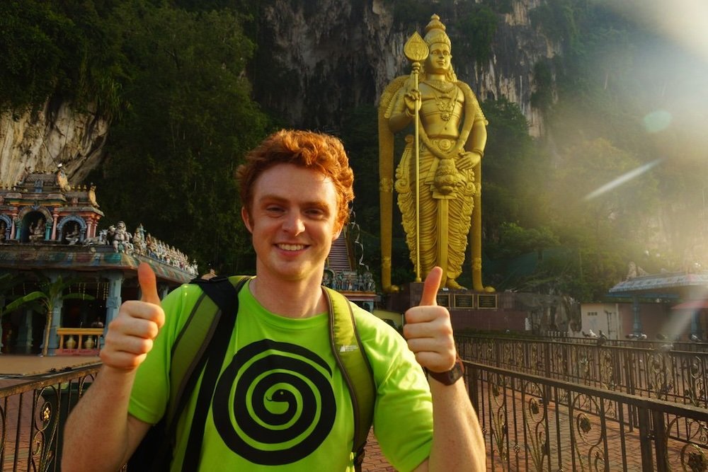 Nomadic Samuel having an epic time at the Batu Caves in Malaysia 