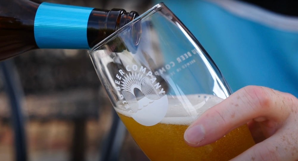 Nomadic Samuel pouring a beer in Daegu, Korea 