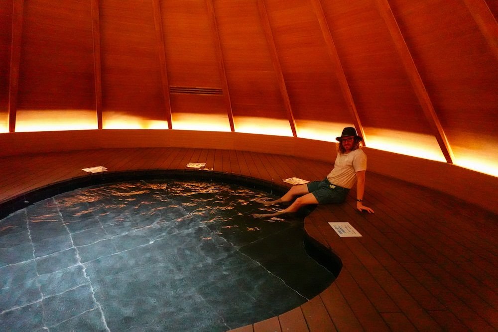 Nomadic Samuel relaxing his feet at the foot onsen at Kiyotsu Gorge, Japan