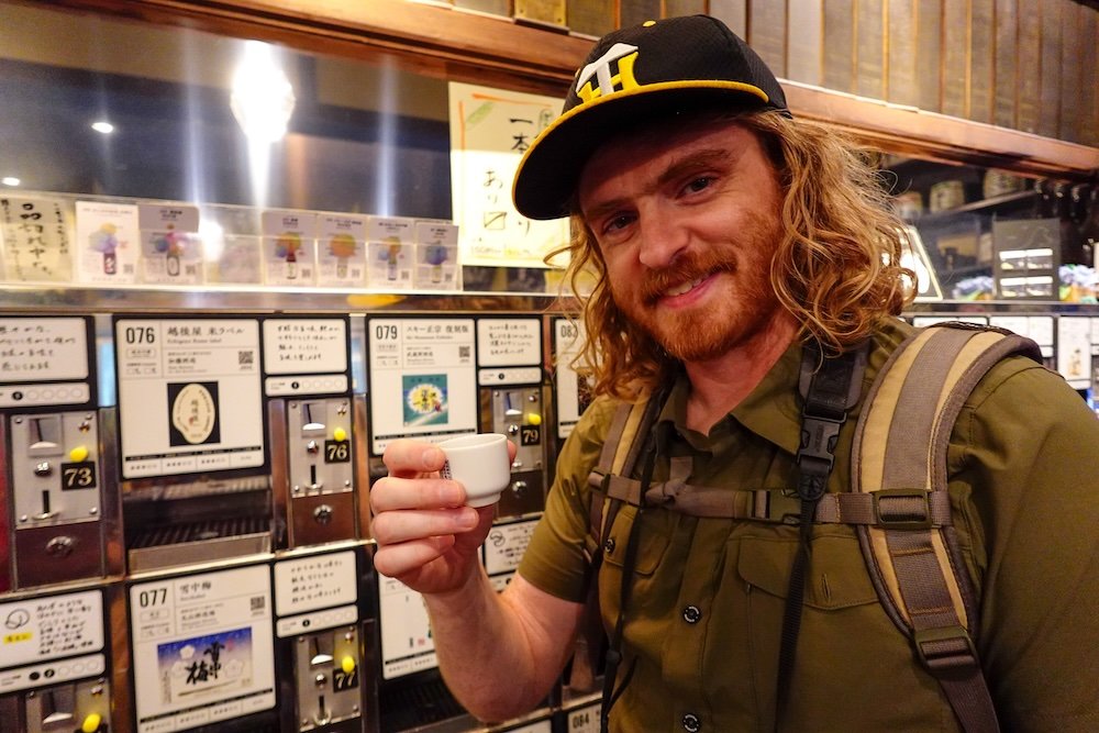 Nomadic Samuel thrilled to be visiting Niigata, Japan drinking sake 