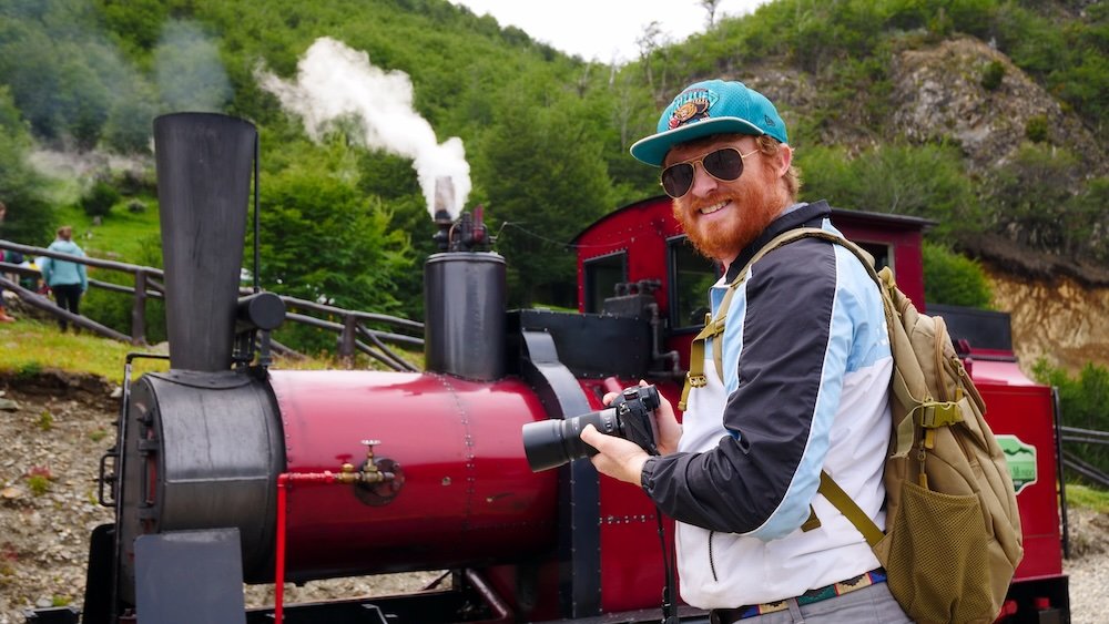 Nomadic Samuel thrilled to be visiting Ushuaia, Tierra del Fuego, Patagonia, Argentina marveling at the train at the end of the world 