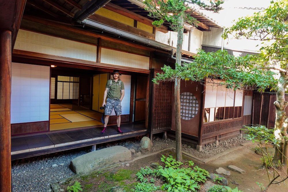 Nomadic Samuel touring historic buildings in Takayama, Japan 