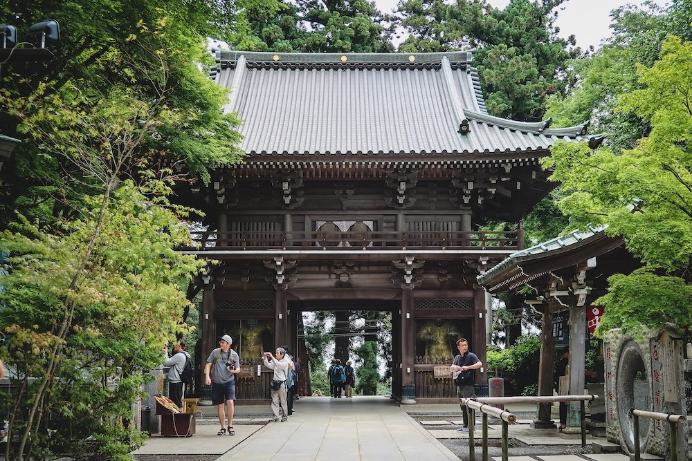 Nomadic Samuel visiting temples in Mount Takao, Japan 