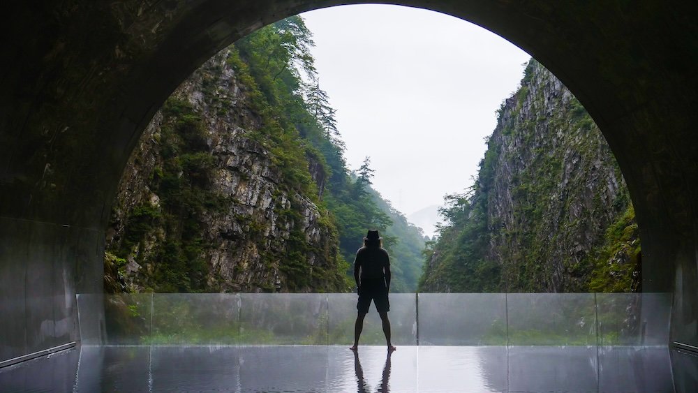 Nomadic Samuel visiting the Tunnel Of Light on a day trip to Kiyotsu Gorge, Japan