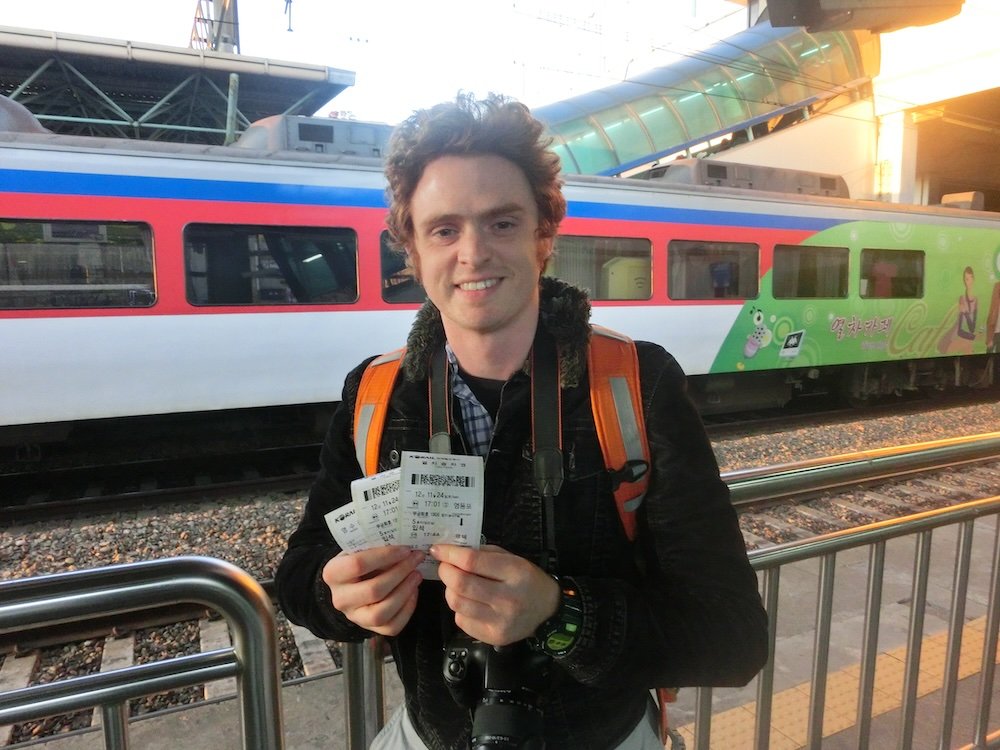 Nomadic Samuel with a train ticket heading to Seoul as a great day trip option from Seongnam 